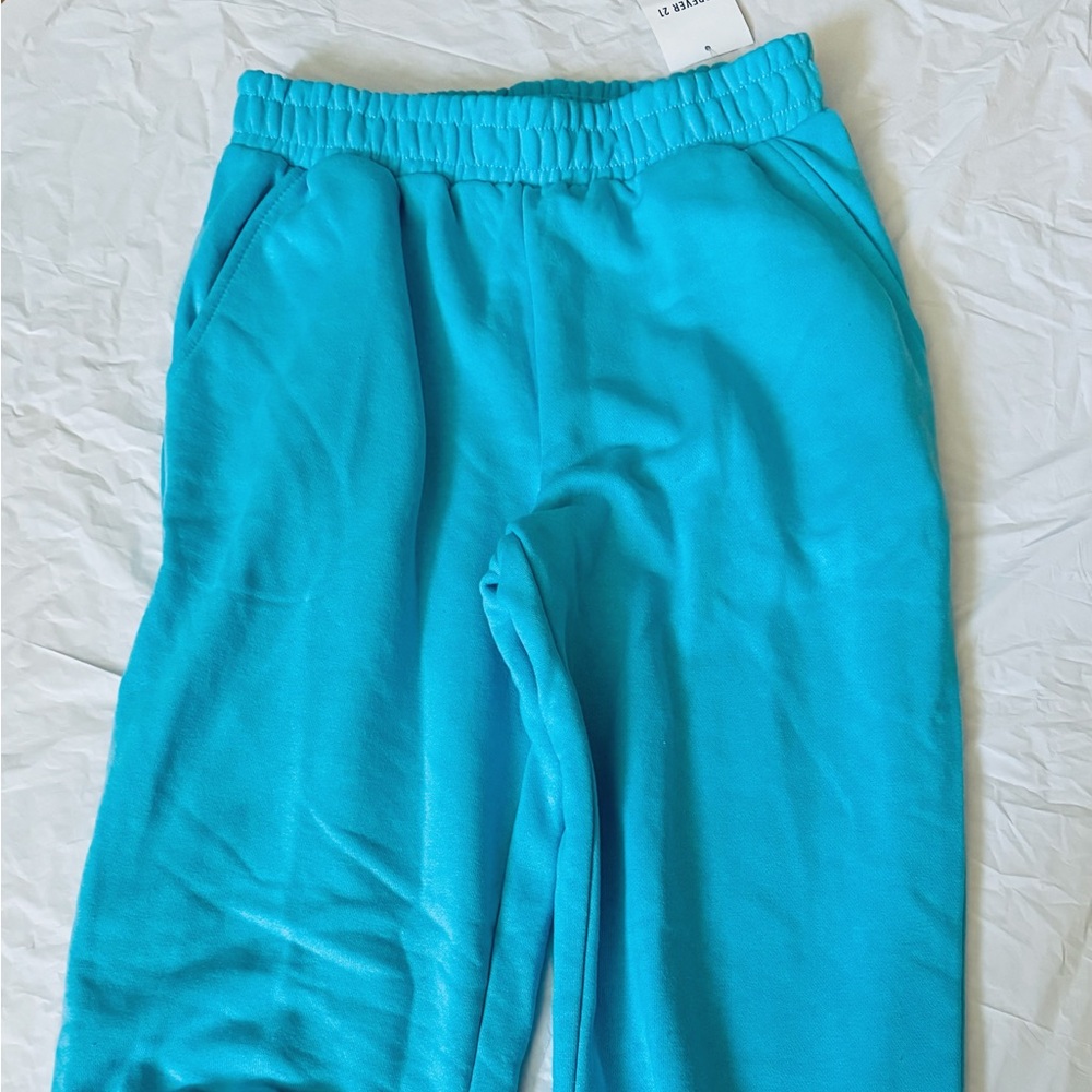 Split leg style bright blue jogger sweatpants